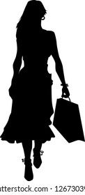 Vector silhouette of an woman walking with a shopping bag