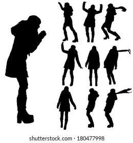 Vector silhouette of woman in winter clothes on a white background. 