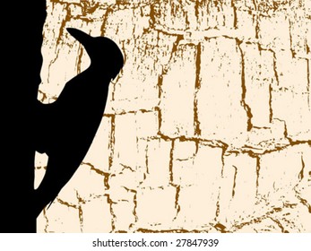 vector silhouette woodpecker on wood background