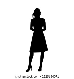 Vector silhouette of a young attractive slender woman in a summer dress, standing, black color, isolated on a white background