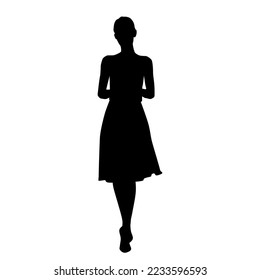 Vector silhouette of a young attractive slender woman in a summer dress, standing, black color, isolated on a white background