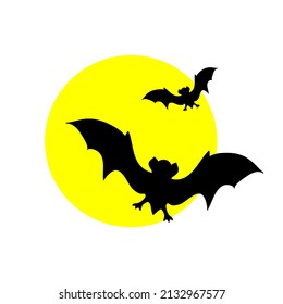 Vector silhouettes of bats on the background of the moon
