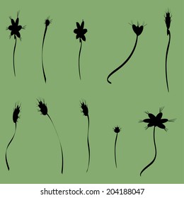 Vector silhouettes of flowers on a green background.