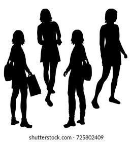 Vector silhouettes of girls standing, different poses,  black color, isolated on white background