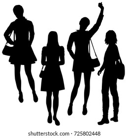 Vector silhouettes of girls standing, different poses,  black color, isolated on white background