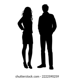 Vector silhouettes of  man and a woman, a couple standing   business people, black  color isolated on white background