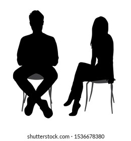 Vector silhouettes of  man and a woman, a group of sitting business people, black color isolated on white background