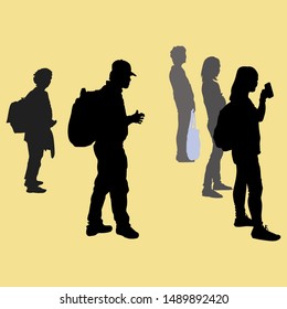 Vector silhouettes of people. Several men and women stand at a full-height stop sideways
