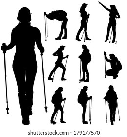 Vector silhouettes of people with walking sticks on a white background. 