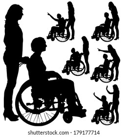 Vector silhouettes of people in a wheelchair on a white background. 