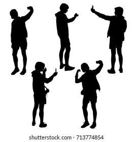 Vector silhouettes teenagers with smart phone, standing, black color, isolated on white background