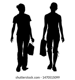 Vector silhouettes of two young slim girls girlfriends in full growth walking with bags, packages in their hands. Shopping trip from the back.