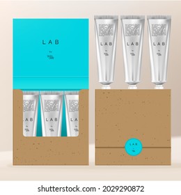 Vector Silver or Metallic Beauty Hand Cream Tube Set. Flip Over Recycled Kraft Paper Packaging Box with Neon Blue Printed Liner.
