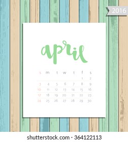 Vector simple modern calendar April 2016 on a colorful wooden texture background. Calligraphy lettering month name