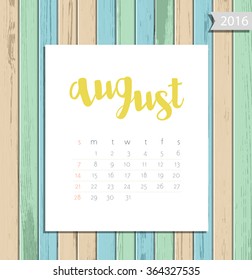 Vector simple modern calendar August 2016 on a colorful wooden texture background. Calligraphy lettering month name