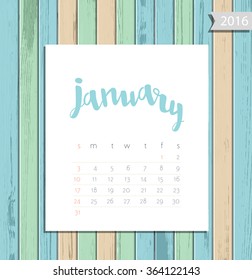 Vector simple modern calendar January 2016 on a colorful wooden texture background. Calligraphy lettering month name