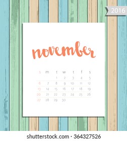 Vector simple modern calendar November 2016 on a colorful wooden texture background. Calligraphy lettering month name