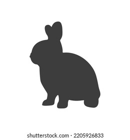 Vector sitting Hare silhouette isolated on white. Black sitting Rabbit silhouette on white background.	