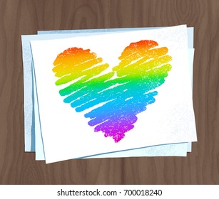 Vector sketch of rainbow colored heart on paper sheets on wooden background.