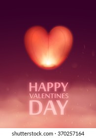 Vector sky lantern in the shape of a heart in the night sky.