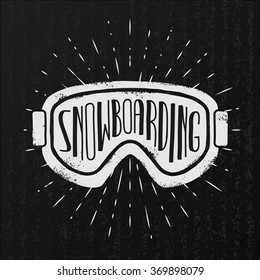 Vector snowboarding label. Goggles and typography on vintage cardboard background.