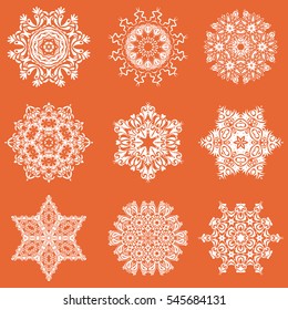 Vector snowflakes set for holiday Thanksgiving day, a simple hand-drawn winter design on a orange background.