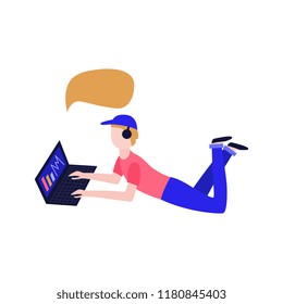 Vector social communication concept with young man male character lying at floor in headphones, cap behind laptop taping, chatting, sending messages with empty speech bubble. Flat illustration