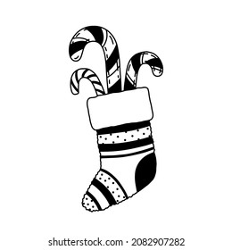Vector sock isolated on white. Hand drawn doodle Christmas stocking with candy canes.