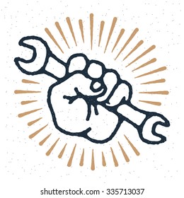 Vector spanner in hand emblem, stamp. Symbol with rays and grunge texture