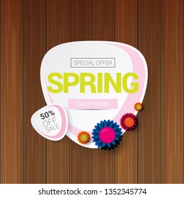 vector spring sale design template banner or tag on wooden background with sun lights. Abstract spring sale pink label or background with beautiful flowers and text.