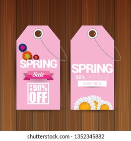 vector spring sale design template banner or tag on wooden background with sun lights. Abstract spring sale pink label or background with beautiful flowers and text.