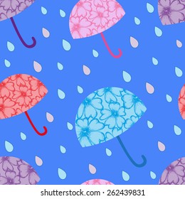 vector spring seamless pattern with the image of multi-colored umbrellas and rain drops