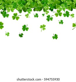 Vector St. Patrick's day horizontal seamless background with green falling shamrock on white.