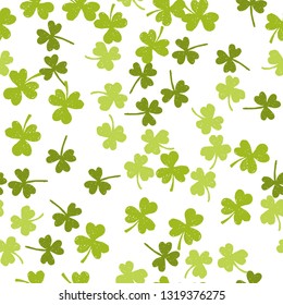 Vector St. Patrick's day seamless pattern with green shamrock leaves on a white background.