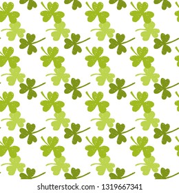 Vector St. Patrick's day seamless pattern with green shamrock leaves on a white background.