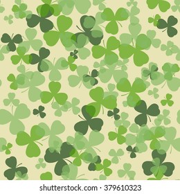 Vector St Patrick's day seamless pattern. Green clover leaves on white or beige background. Irish design for card, invitation or greeting, textile, website, brochures and booklets