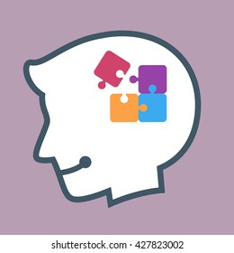 Vector stock of human head silhouette with puzzle pieces inside