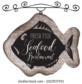 Vector street signboard or banner for seafood restaurant with a picture of fish and handwritten inscription on a wooden background in retro style.