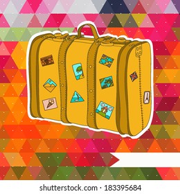 Vector suitcase on the colorful triangle background.