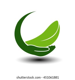 Vector symbol of green energy.  Circular natural element with leaf and hand. Nature icon.
