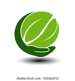 Vector symbol of green energy.  Circular natural element created leaves with hand. Nature icon.