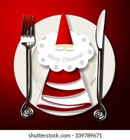 Vector of table setting. with silver fork, knife and santa claus card on napkin in christmas tree shape on white plate