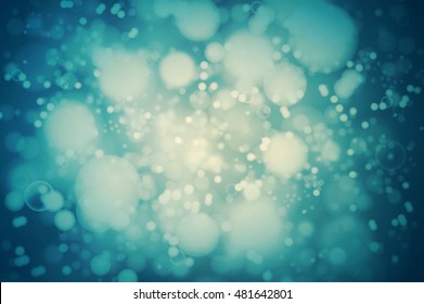 Vector teal bokeh background. abstract defocused bright lights