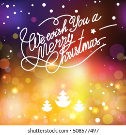 Vector template with lettering We wish You a Merry Christmas. Abstract blur and bokeh colorful background.