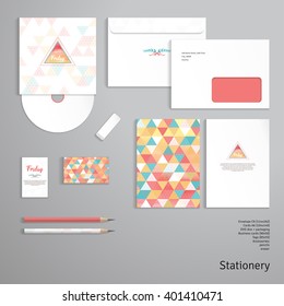 Vector templates. Envelope, cards, business cards, tags, disc with packaging, pencils, eraser. Multicolored triangles and grid. Inscription "Happy friday". Delicate backdrop. 