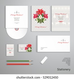 Vector templates. Envelope, cards, business cards, tags, disc with packaging, pencils, eraser. Holly, poinsettia and hellebore flowers. Norwegian ornament. Christmas collection. Place for your text