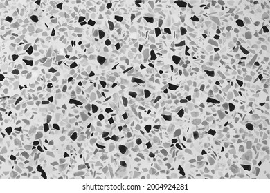 Vector terrazzo flooring marble stone wall texture abstract background. black and gray stone on white terrazzo floor tile on cement surface, architecture interior design pattern. Vector illustration
