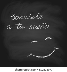 Vector text in Spanish Smile to your dream. Chalk on blackboard