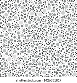 Vector texture of randomly arranged isolated gray circles of various sizes and shades
