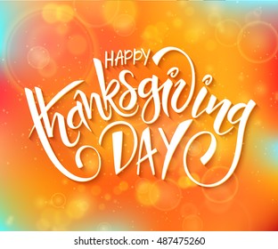 vector thanksgiving day greeting lettering phrase - happy thanksgiving day - on blur autumn background with flares.